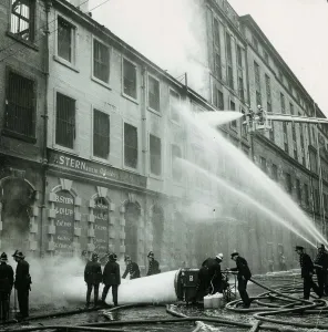 Hosepipe Prints: Firemen hosing down a building after a warehouse fire on James Watt Street in Glasgow