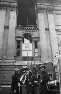 Hose Prints: Firemen of the NFS outside The Mansion House in the City of London which was damaged by