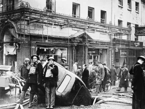 01463 Prints: Firemen each sandwiches amidst bomb damage somewhere in the West of England during Second