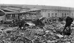 Firefighters Prints: Firemen tackle a blaze near Waterloo Station where a store of phosphorous bombs was set