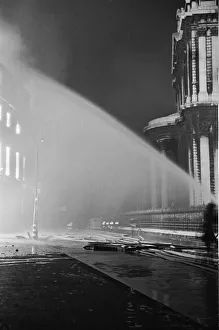 Firemen tackling fires in St Pauls Churchyard to stop the blaze reaching