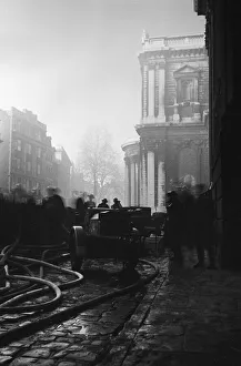 Firemen tackling fires in St Pauls Churchyard to stop the blaze reaching