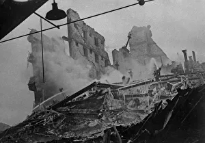 Firemen try to dampen down the fire following the destruction of The Corporation Granary