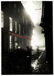Hoses Prints: Fires blazing in a shopping district of London MOI Dated 17th April 1941 *** Local