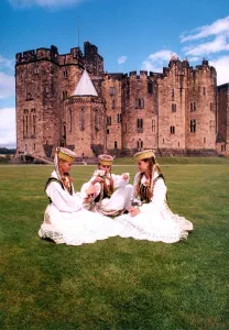 The first arrivals for the Alnwick Music Festival relax on the lawn of the Castle