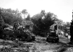 The first British regiment into Germany. Honey Reece tanks arriving with burnt out