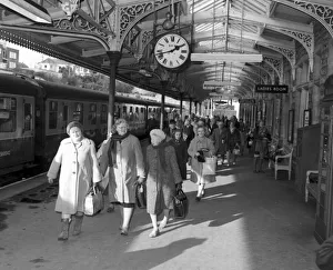 Holidaymakers Prints: The first holiday train from Eastbourne and Brighton arriving at Torquay railway station