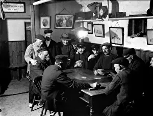 Games Prints: Fishermen in the little Cornish fishing village of Mousehole enjoying a game of cribbage