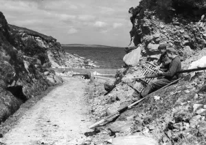 Flat Caps Prints: Fishermen seen here on Achill Island County Mayo Ireland repairing their lobster pots