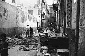 00671 Collection: Fishermen seen here repairing their nets in a Alexandria back street. 29th May 1976