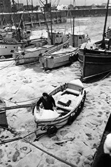 01000 Collection: Fishing boats frozen in Whitstable Harbour, Kent. 20th January 1966