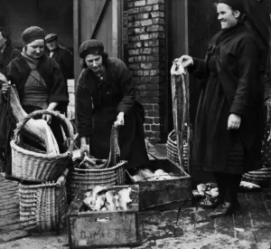 Fishwives of Cullercoats filling their creels for the days rounds at North Shields Fish