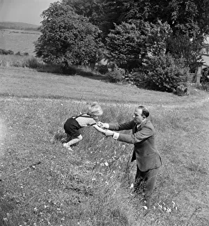 Fitzroy Maclean playing with his son Charles at home at Yealand Conyers, Lancashire. 1949