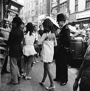 Streets Prints: Flam-flam hippie girls from The Pink Flamingo Club on Wardour Street in Soho are asked