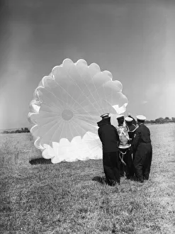 Parachute Prints: Fleet Air Arm parachute packers seen here testing a parachute at an un-named Royal Naval