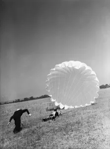 01479 Prints: Fleet Air Arm parachute packers seen here testing a parachute at an un-named Royal Naval