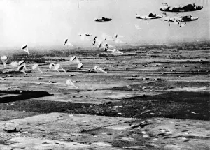 Flying Prints: A flight of B24 Liberators swoops in low over the Dutch countryside to drop supplies to