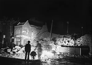 Bombing Prints: Floodlights light the scene of a V2 explosion close to Tottenham Court Road which killed