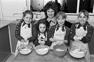 Brownies Prints: Flour power... Brownie helper Diane Felton shows these members of St Francis