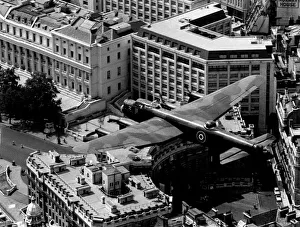 The last flying RAF Lancaster bomber over Admiralty Arch at the start of the mall in