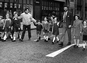 Broadcaster Prints: Folk singers Jimmie Macgregor (left) and Robin Hall with the Edinburgh children who are