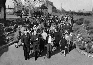 Followed by local children the tutti-men set out to pay their calls for a coin or a kiss