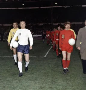Football England v Wales 1969 Bobby Moore walks on to the pitch with ball under