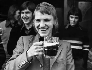 Football fan Paul Morgan enjoys a pint of beer before going to watch his team