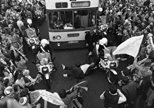 Parades Prints: Football supporter lying in the road at Scotland Road as he tries to impede the bus