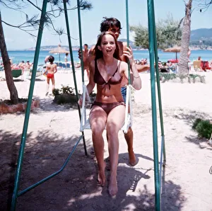Footballer George Best with actress and model Susan George on holiday in Palma Nova