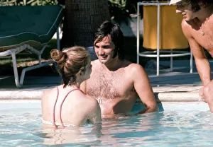 Wags Prints: Footballer George Best relaxes with girlfriend Linda Joinett in a swimming pool in Palm
