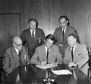 Footballer Peter Thompson signs for his new club Liverpool after his £37