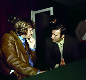 Footballer Rodney Marsh speaks with Manchester City manager Malcolm Allison after signing