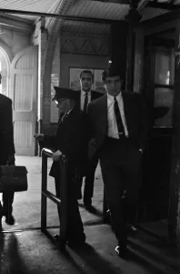 Footballer Terry Venables on his way to work using public transport in London