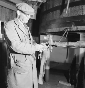 Security Prints: Foreman at the AGlenlivet Distillery seen here unlocking the alcohol safe so sherry