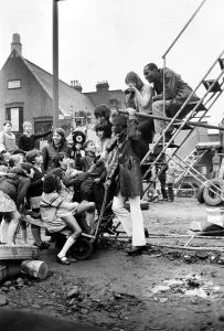 00027 Prints: The Foundations pop group surrounded by children at the Notting Hill playground