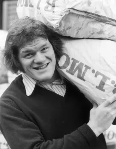 Fran Cotton, Englands new Rugby Union captain helping his team mate Keith