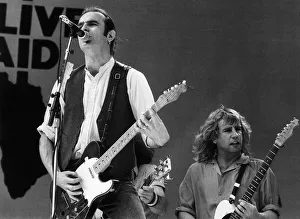 Francis Rossi lead singer with Pop Group Status Quo singing on stage at Live Aid concert
