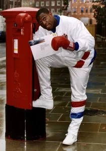 Frank Bruno former Boxer posting a Special Delivery to Lennox Lewis