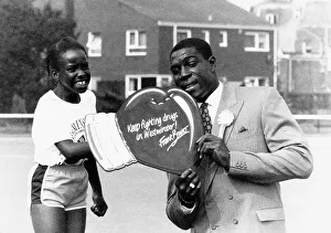 00131 Prints: Frank Bruno Boxing with an anti drug message attended Westminster primary schools sports