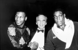 Frank Bruno Boxing and Mike Tyson shake hands watched over by promoter Micky Duff