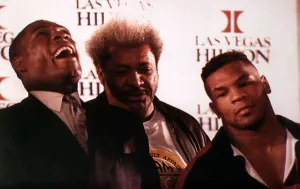 Frank Bruno Mike Tyson boxers with promotor Don King at a press conference