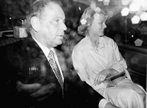 Frank Sinatra and girlfirend Barbara Marx driving in rainy London