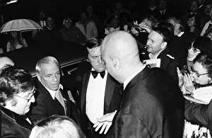 00065 Prints: Frank Sinatra Singer and Actor flanked by bodyguards as he arrived at the Albert Hall