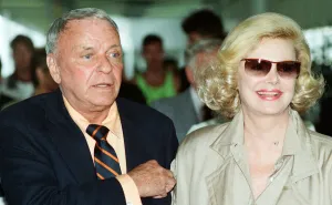 00303 Prints: Frank Sinatra and wife Barbara Marx seen here arriving at Heathrow Airport 28th June 1990