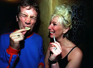 Frank Skinner eats a lemon watched by comedian Jenny Eclair at at Edinburgh Festival