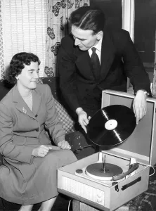 Record Player Prints: Frank Thompson and his wife, Maureen, listen to a recording of their marriage service