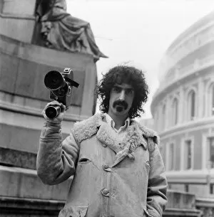 Images Dated 8th February 1971: Frank Zappa and his movie camera at the Royal Albert Hall. February 1971 71-12000-001