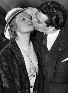 Frankie Vaughan actor gives Anna Neagle a kiss at Variety Awards April 1958