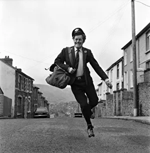Fred Henderson, 49, makes speedy deliveries with the local post with balletic leaps along